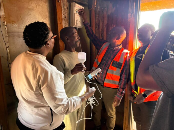 Cllr Frans Boshielo in one of the zone 14 residents house